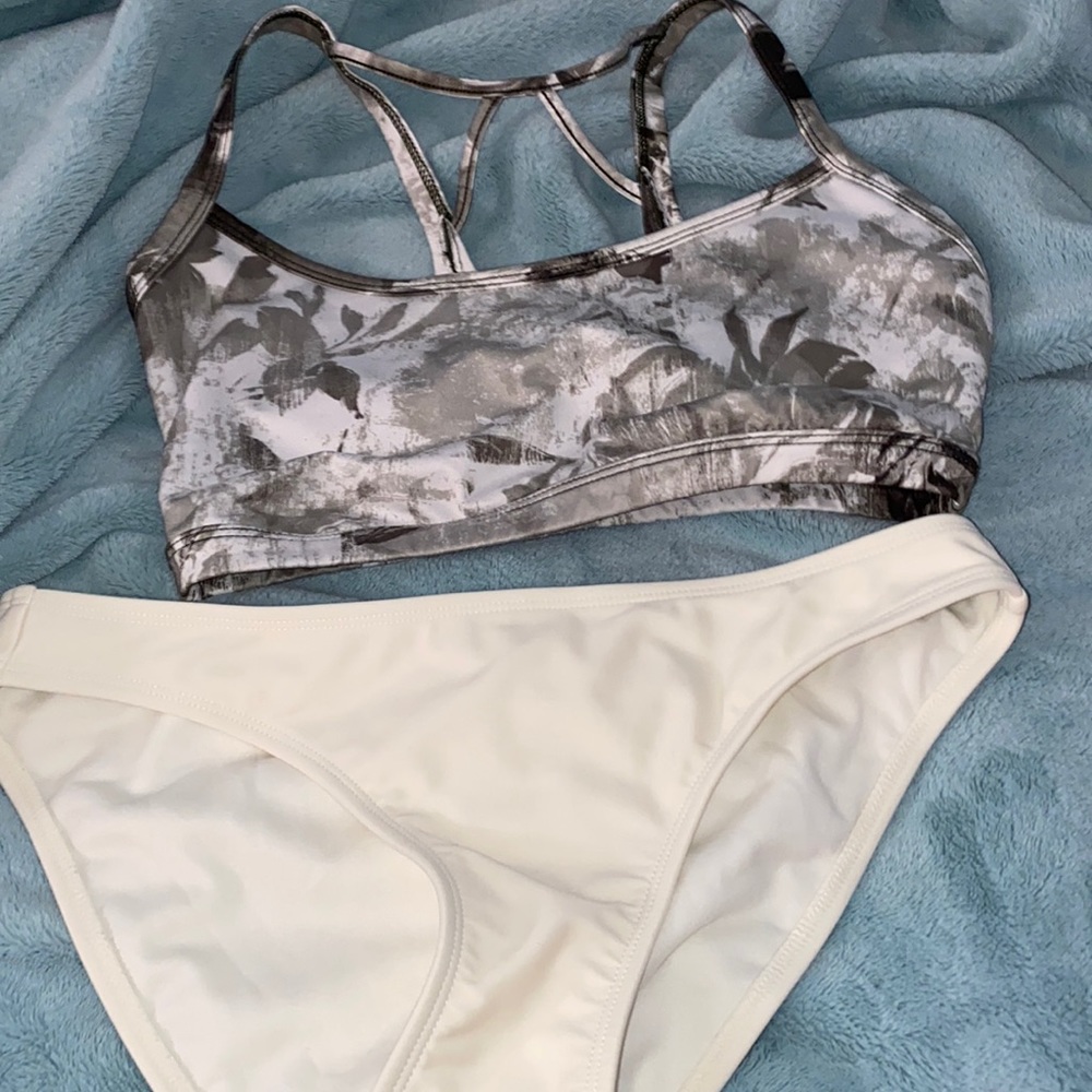 Green swimsuit top and white bottoms